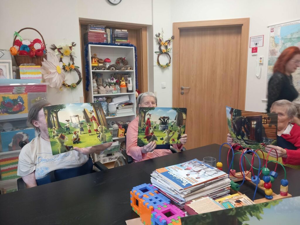 Kilka osób z książkami przy stole